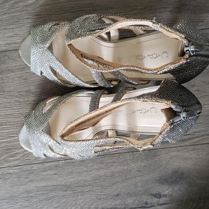 High Heels By CAPARROS , Size 7.5 Silver  Open Concept   Zipps at the Heel